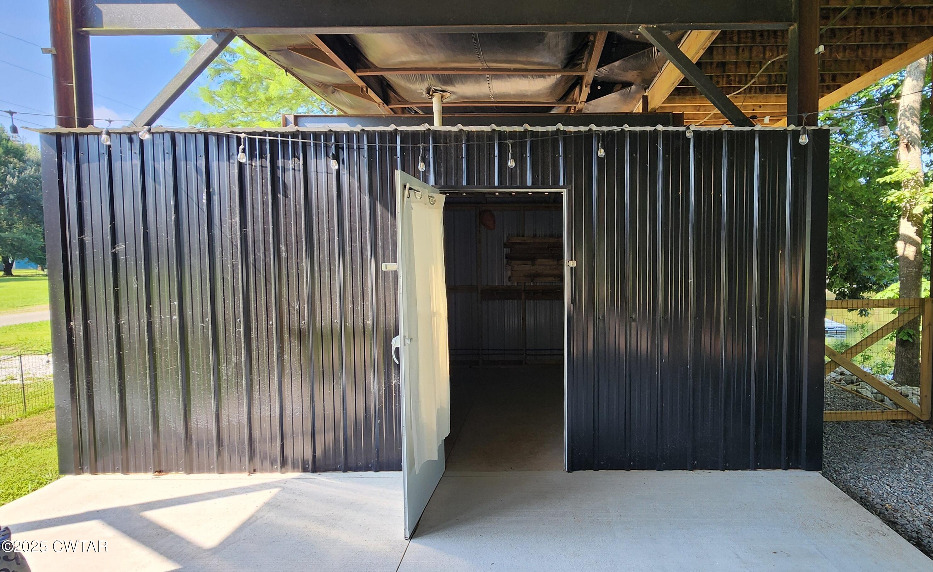 407 Pevahouse Camp Lane Decaturville, TN 38329 - Photo 31 of 44 outside bath shed