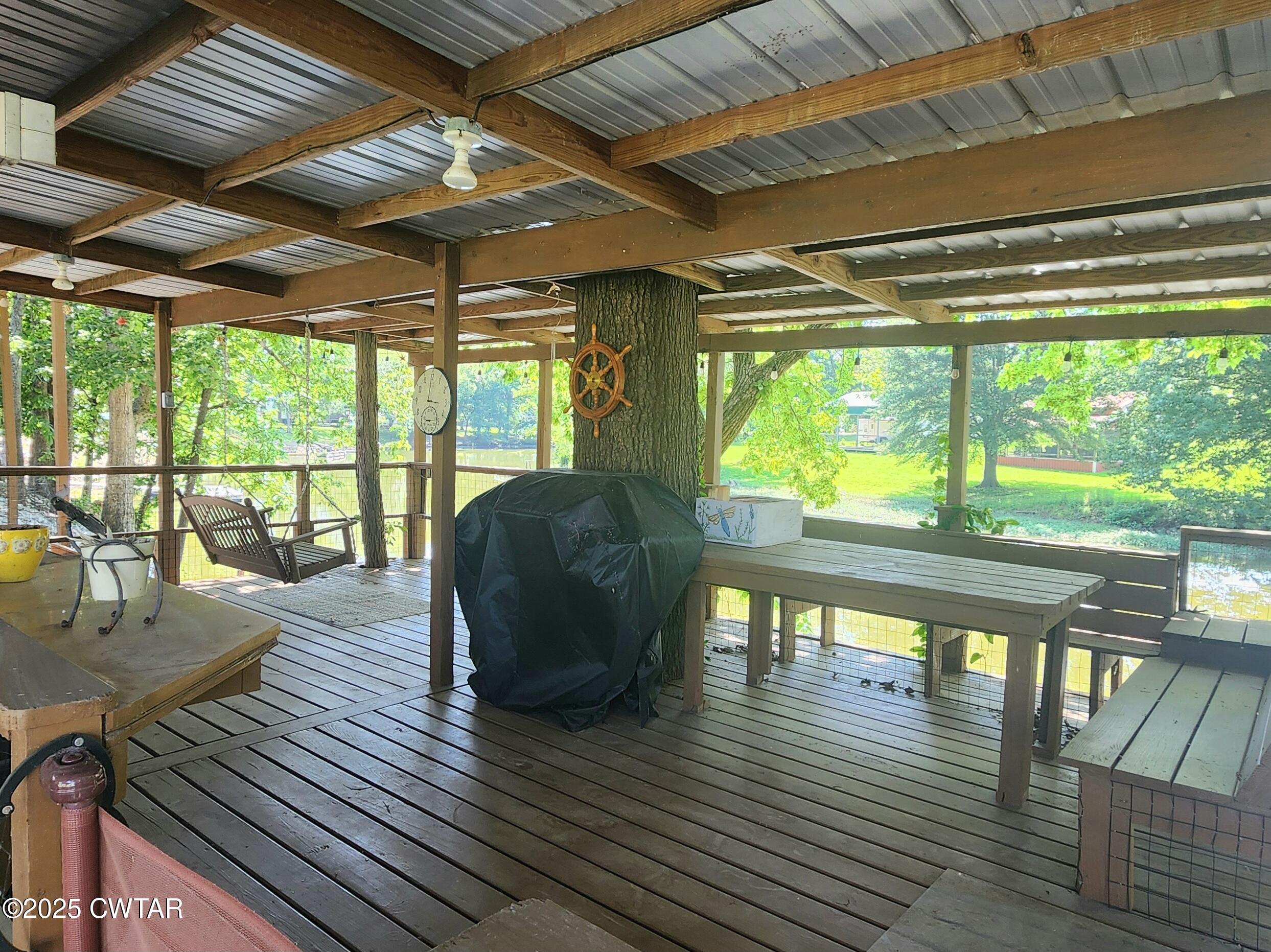 407 Pevahouse Camp Lane Decaturville, TN 38329 - Photo 40 of 44 deck porch 2