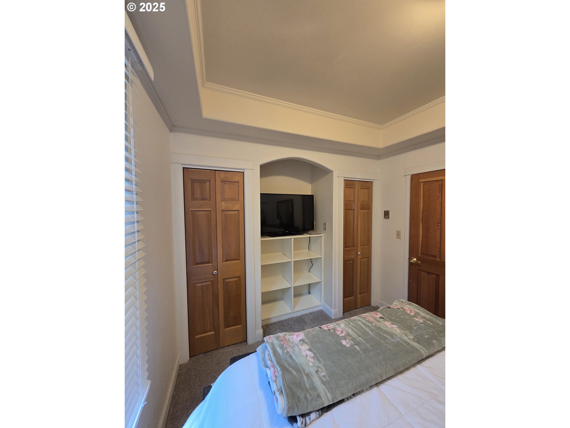 407 Residence Street Enterprise, OR 97828 - Photo 17 of 43 a living room with a bed and a flat screen tv