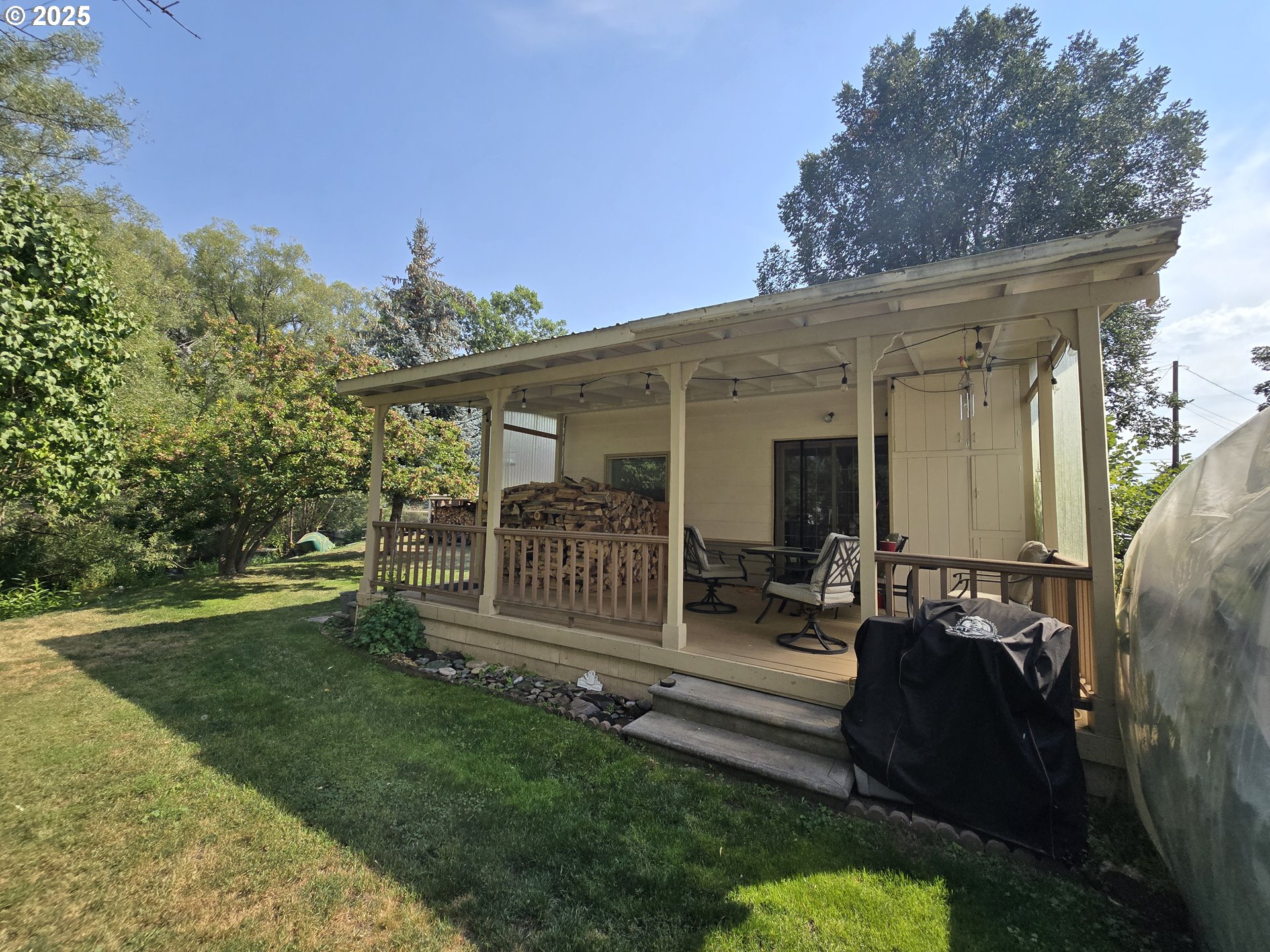 407 Residence Street Enterprise, OR 97828 - Photo 25 of 43 a view of a house with backyard and a garden