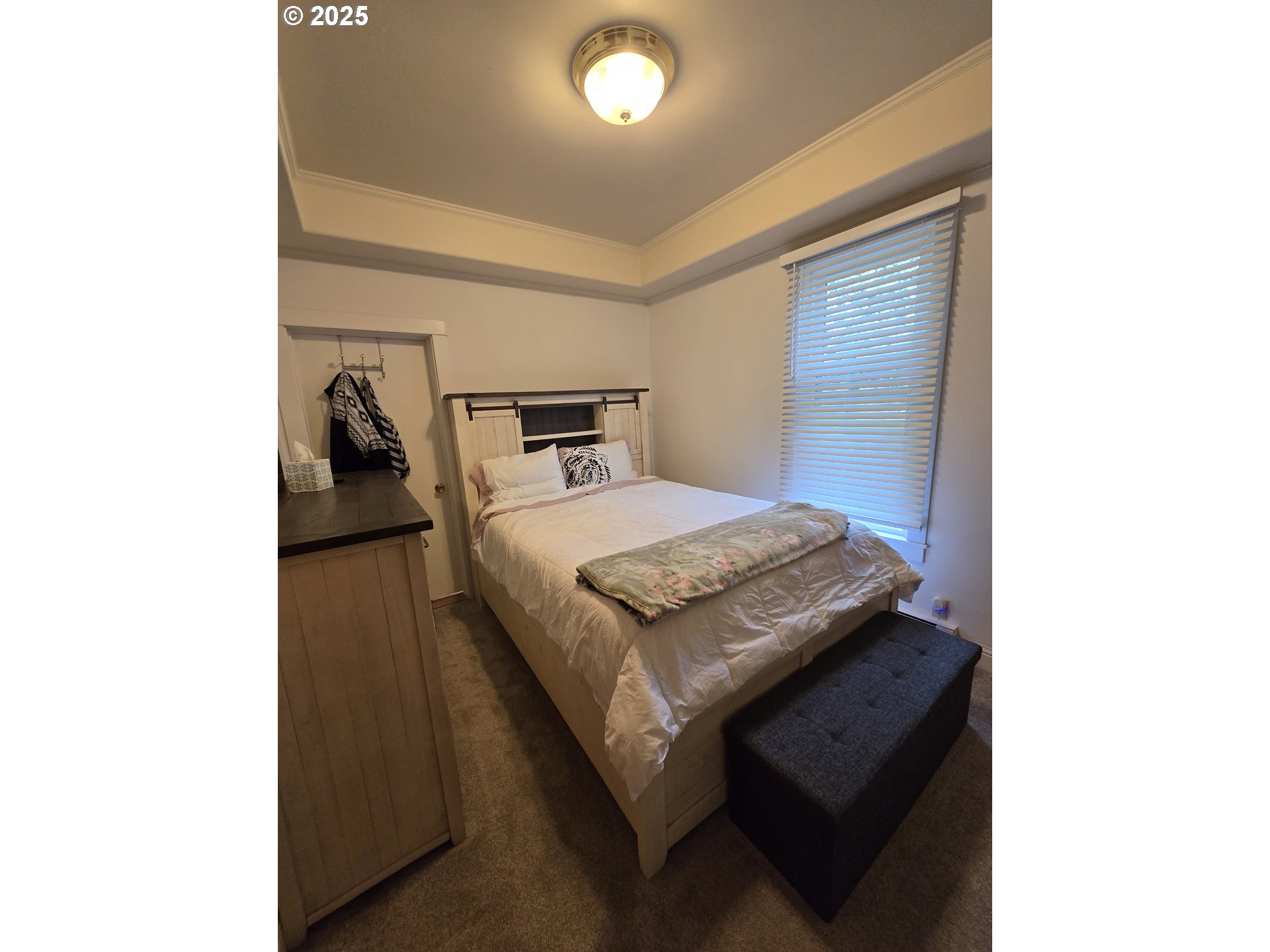 407 Residence Street Enterprise, OR 97828 - Photo 33 of 43 a bedroom with a bed and a night stand