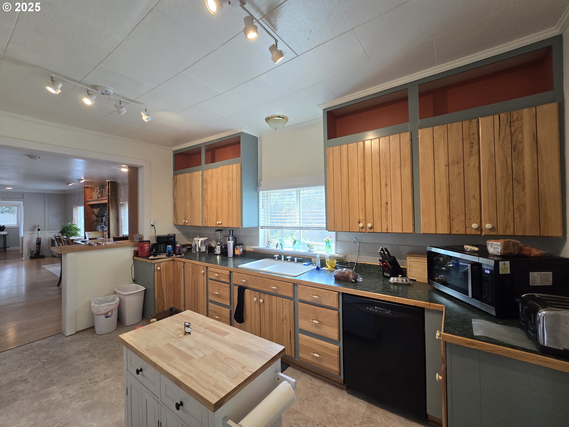 407 Residence Street Enterprise, OR 97828 - Photo 36 of 43 a kitchen with a sink stove and cabinets