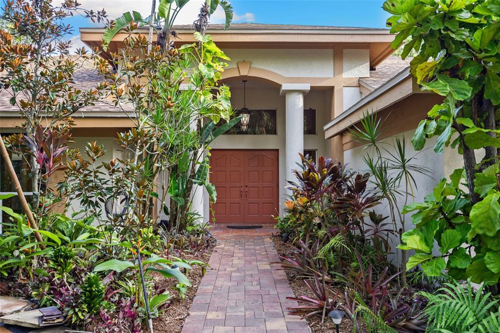 1343 Ranchero Drive Sarasota, FL 34240 - Photo 16 of 68 a house with a flower garden