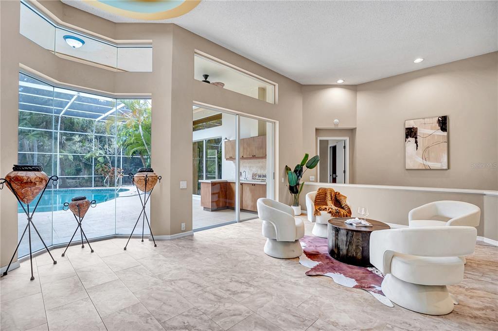 1343 Ranchero Drive Sarasota, FL 34240 - Photo 18 of 68 a living room with furniture and a large window