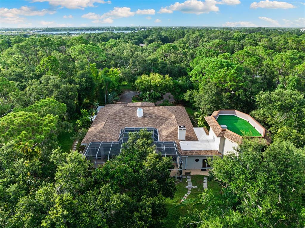 1343 Ranchero Drive Sarasota, FL 34240 - Photo 3 of 68 an aerial view of a house with a yard and lake view
