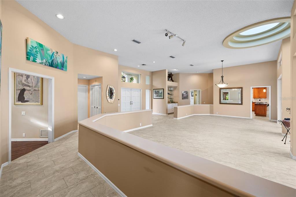 1343 Ranchero Drive Sarasota, FL 34240 - Photo 31 of 68 a large kitchen with stainless steel appliances a large counter top and a refrigerator