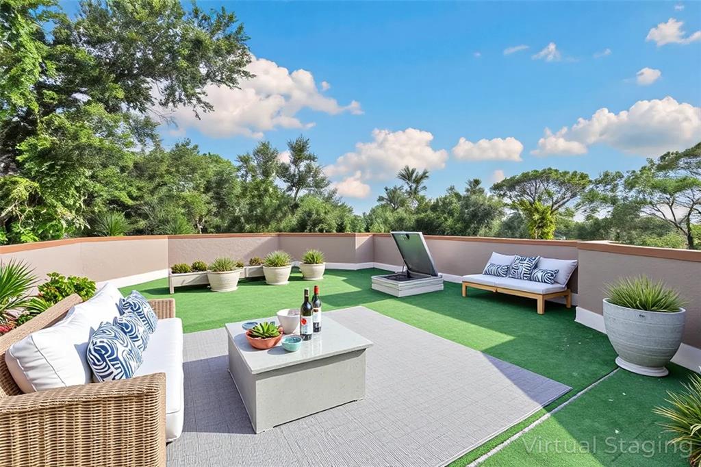 1343 Ranchero Drive Sarasota, FL 34240 - Photo 43 of 68 a garden view with a seating space