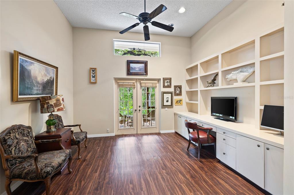 1343 Ranchero Drive Sarasota, FL 34240 - Photo 46 of 68 a living room with furniture a flat screen tv and a window