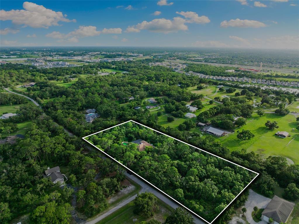 1343 Ranchero Drive Sarasota, FL 34240 - Photo 68 of 68 a view of a city from a balcony with lots of trees