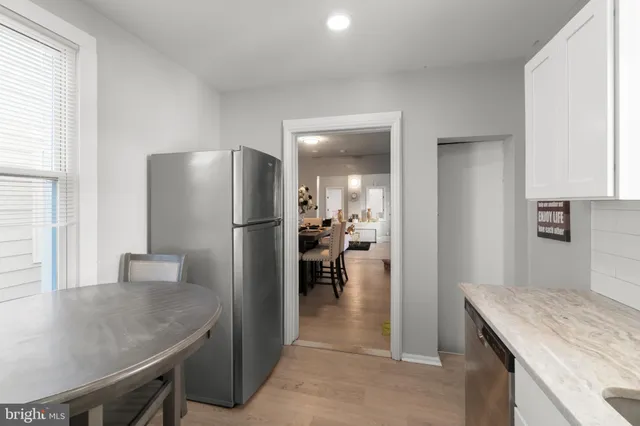 a living room with furniture and a gym equipment