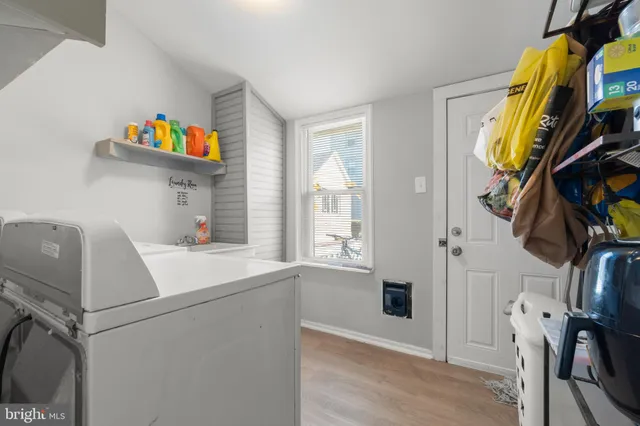 a swimming pool with yard and trees in the background