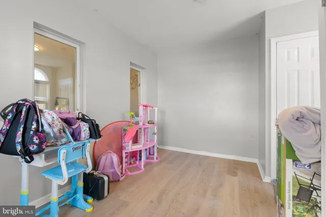 a bed room with a bed and a chair