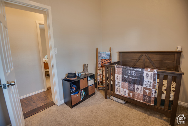 410 North Main Street Beaver, UT 84713 - Photo 11 of 31 Carpeted bedroom featuring a crib