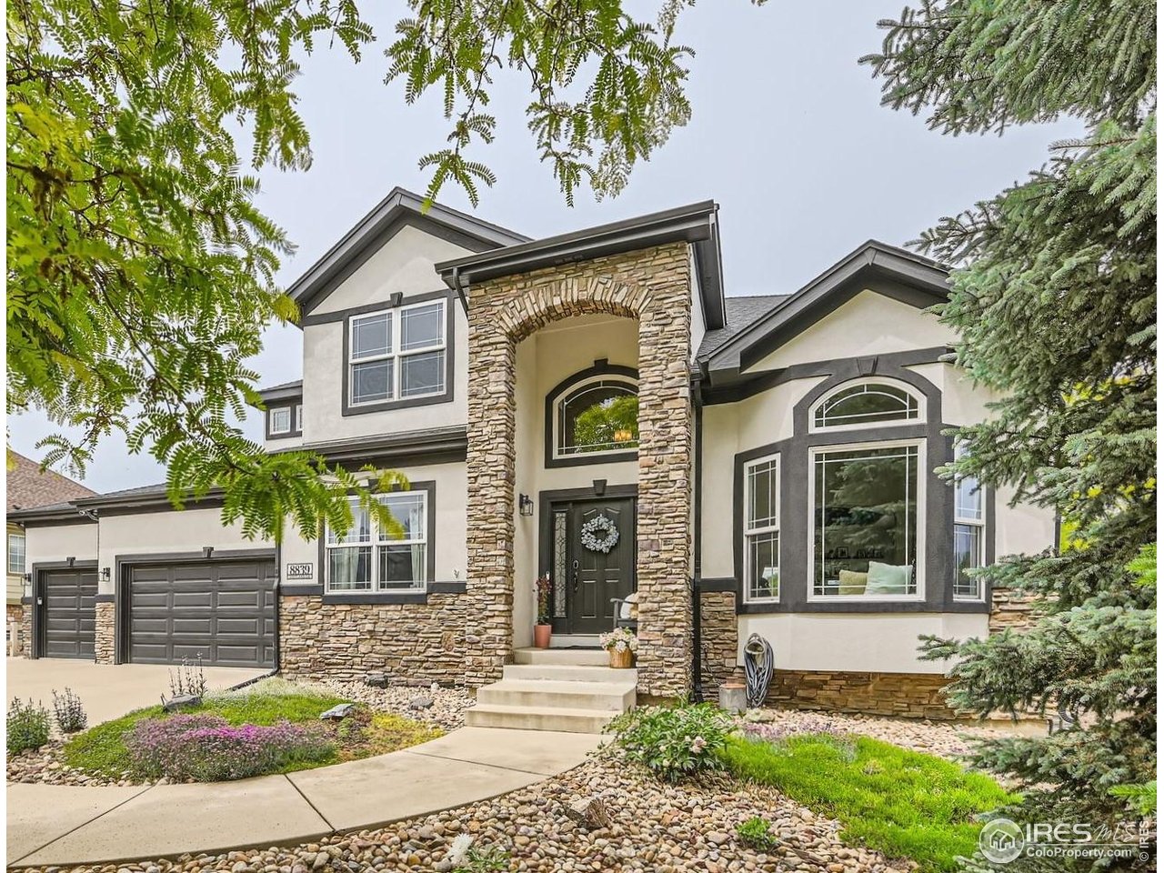 a front view of a house with garden