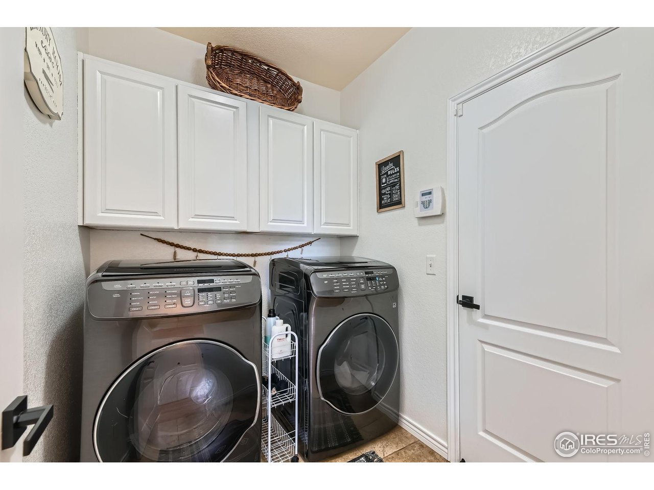 8839 Shetland Drive Frederick, CO 80504 - Photo 18 of 40 a view of washer and dryer