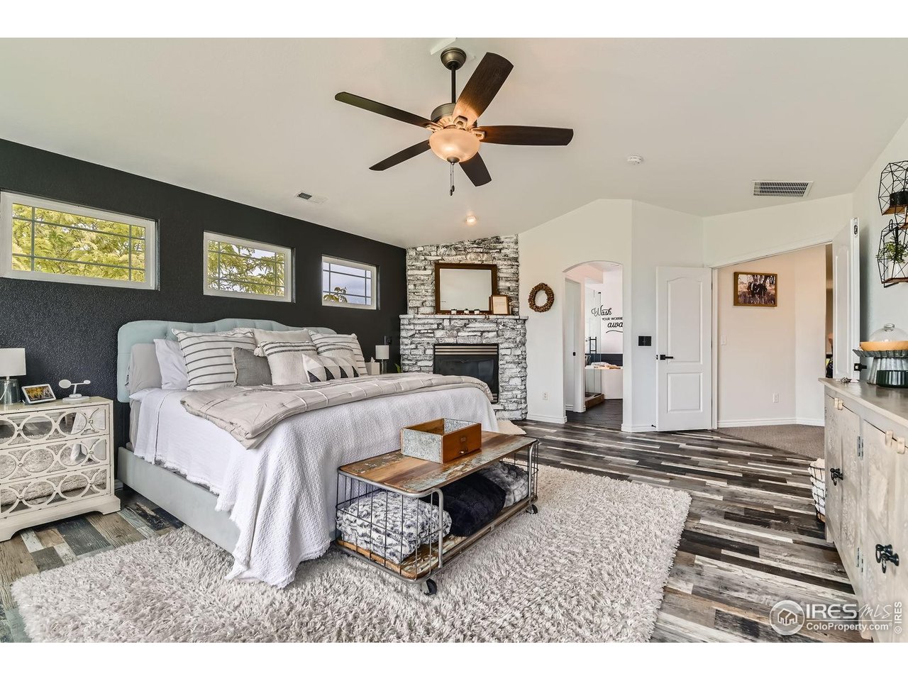 8839 Shetland Drive Frederick, CO 80504 - Photo 21 of 40 a bedroom with a bed and ceiling fan