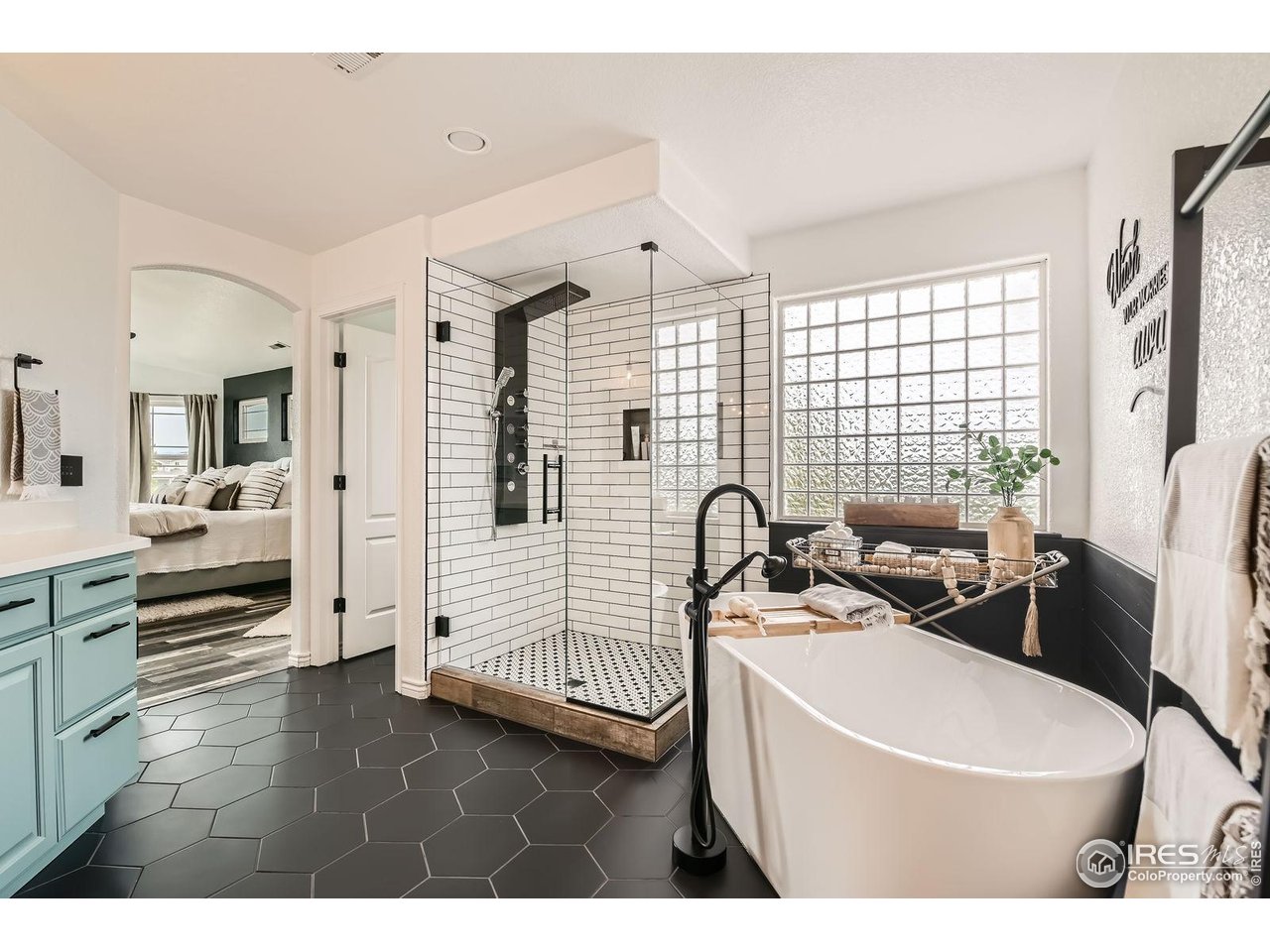 8839 Shetland Drive Frederick, CO 80504 - Photo 23 of 40 a bathroom with a sink a toilet and a bathtub