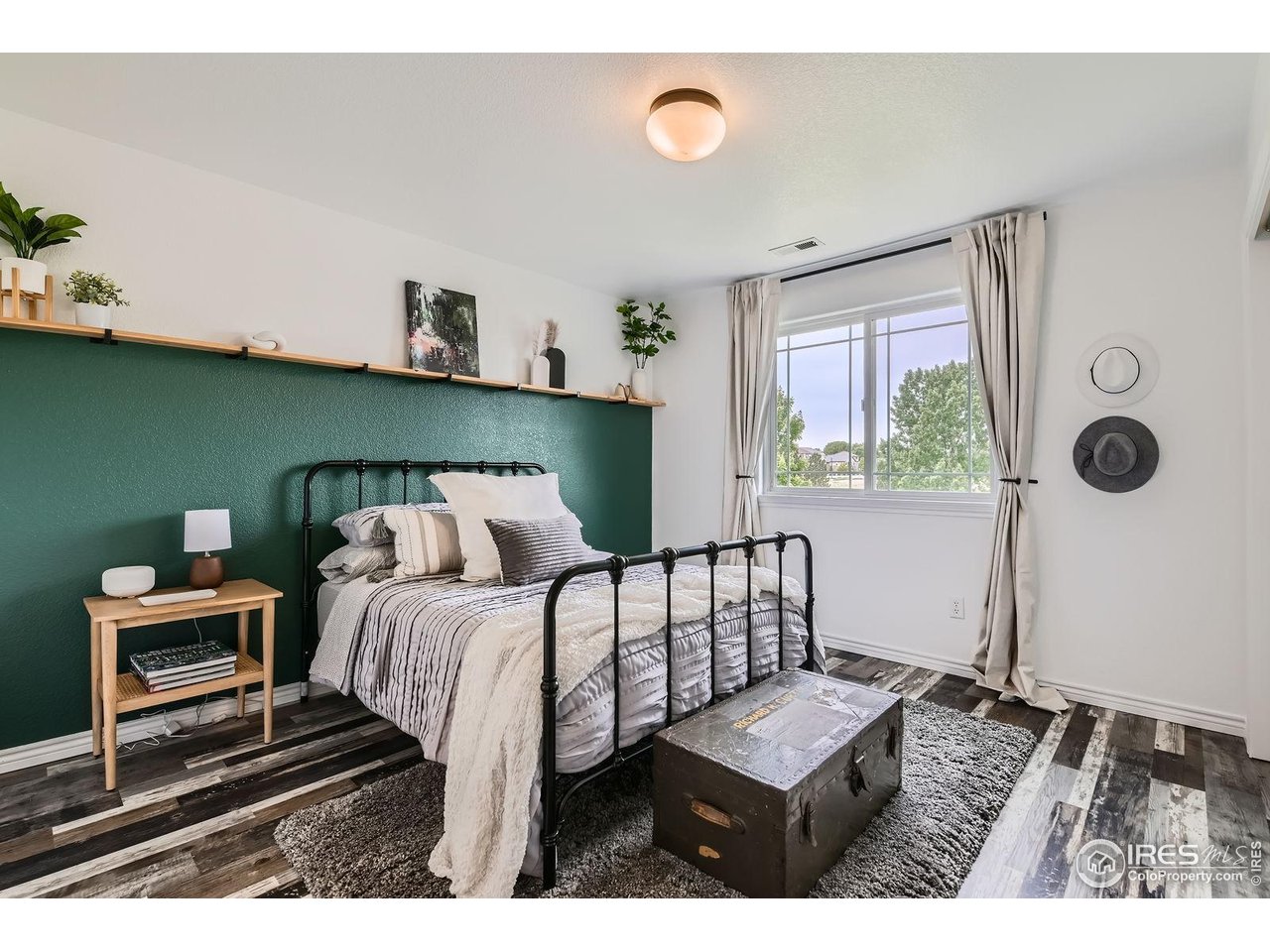 8839 Shetland Drive Frederick, CO 80504 - Photo 24 of 40 a bedroom with furniture and a window