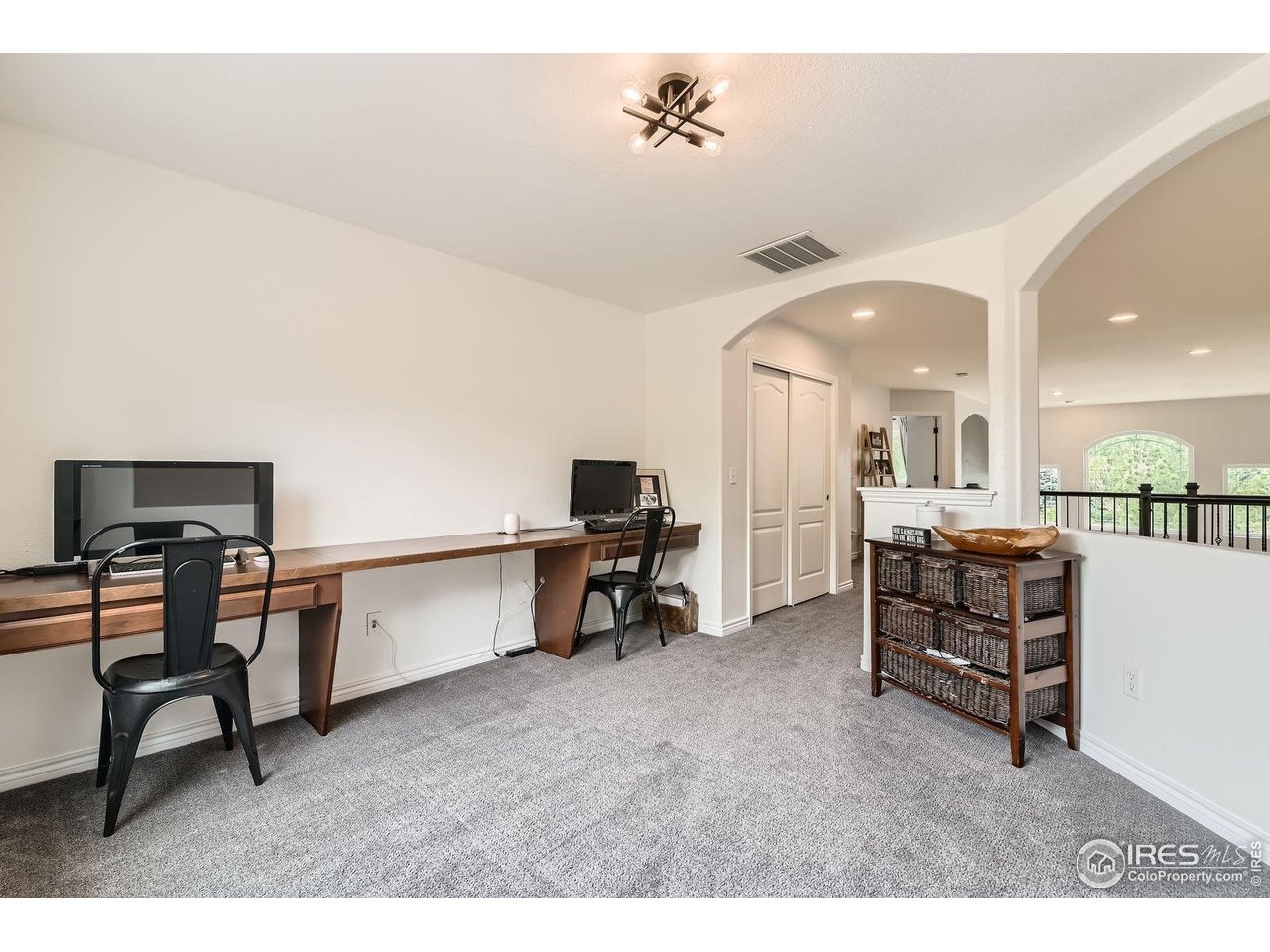 8839 Shetland Drive Frederick, CO 80504 - Photo 28 of 40 a living room with furniture and a dining table