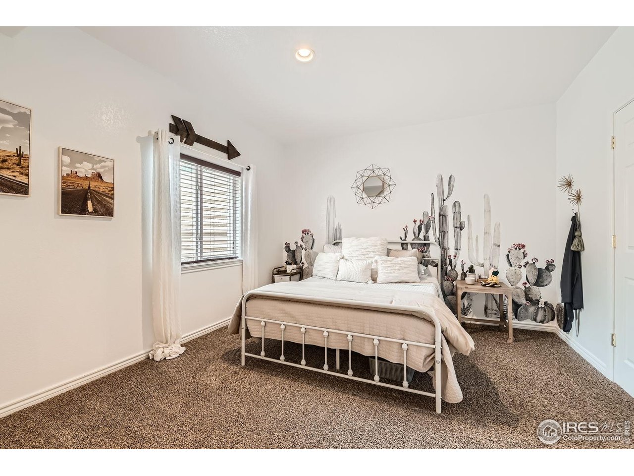 8839 Shetland Drive Frederick, CO 80504 - Photo 32 of 40 a bedroom with a bed and a window