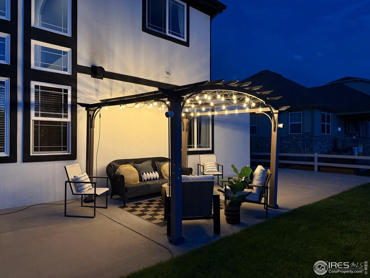 8839 Shetland Drive Frederick, CO 80504 - Photo 39 of 40 a view of a porch with furniture and yard