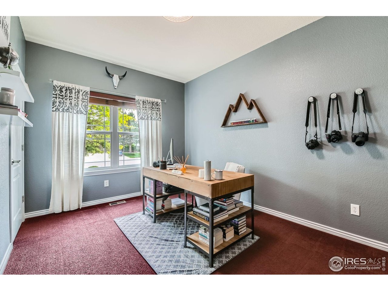 8839 Shetland Drive Frederick, CO 80504 - Photo 9 of 40 a workspace with furniture and window