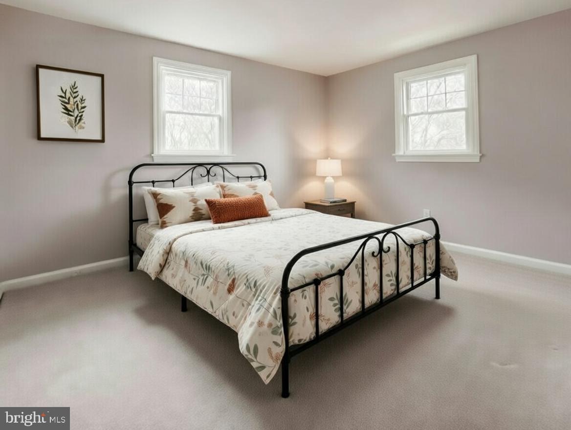 1228 Clyde Road Warminster, PA 18974 - Photo 11 of 19 a bedroom with a bed lamp and a window