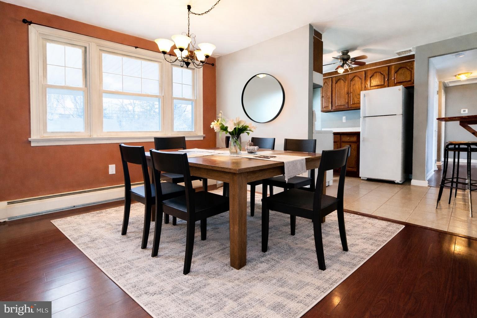 1228 Clyde Road Warminster, PA 18974 - Photo 5 of 19 a view of a dining room with furniture window and wooden floor
