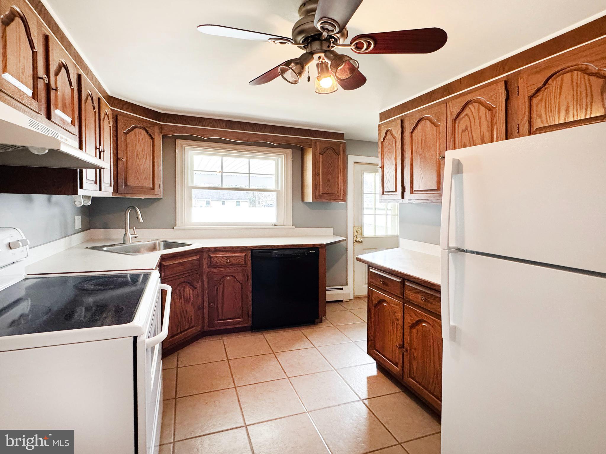 1228 Clyde Road Warminster, PA 18974 - Photo 8 of 19 a kitchen with a cabinets and a stove