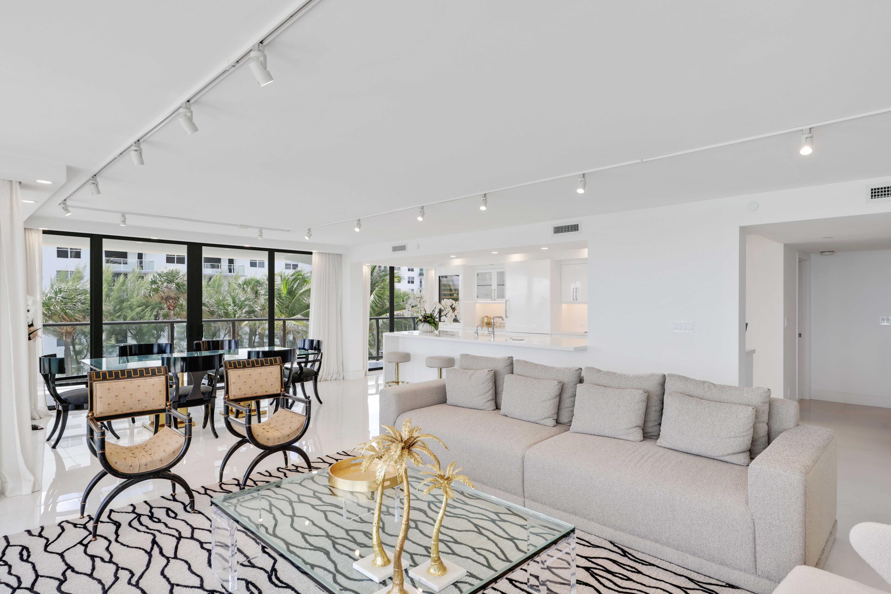 3440 South Ocean Boulevard, Unit 402S Palm Beach, FL 33480 - Photo 12 of 33 a living room with furniture and a large window