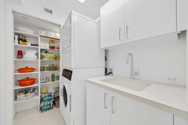 a kitchen with refrigerator and washer