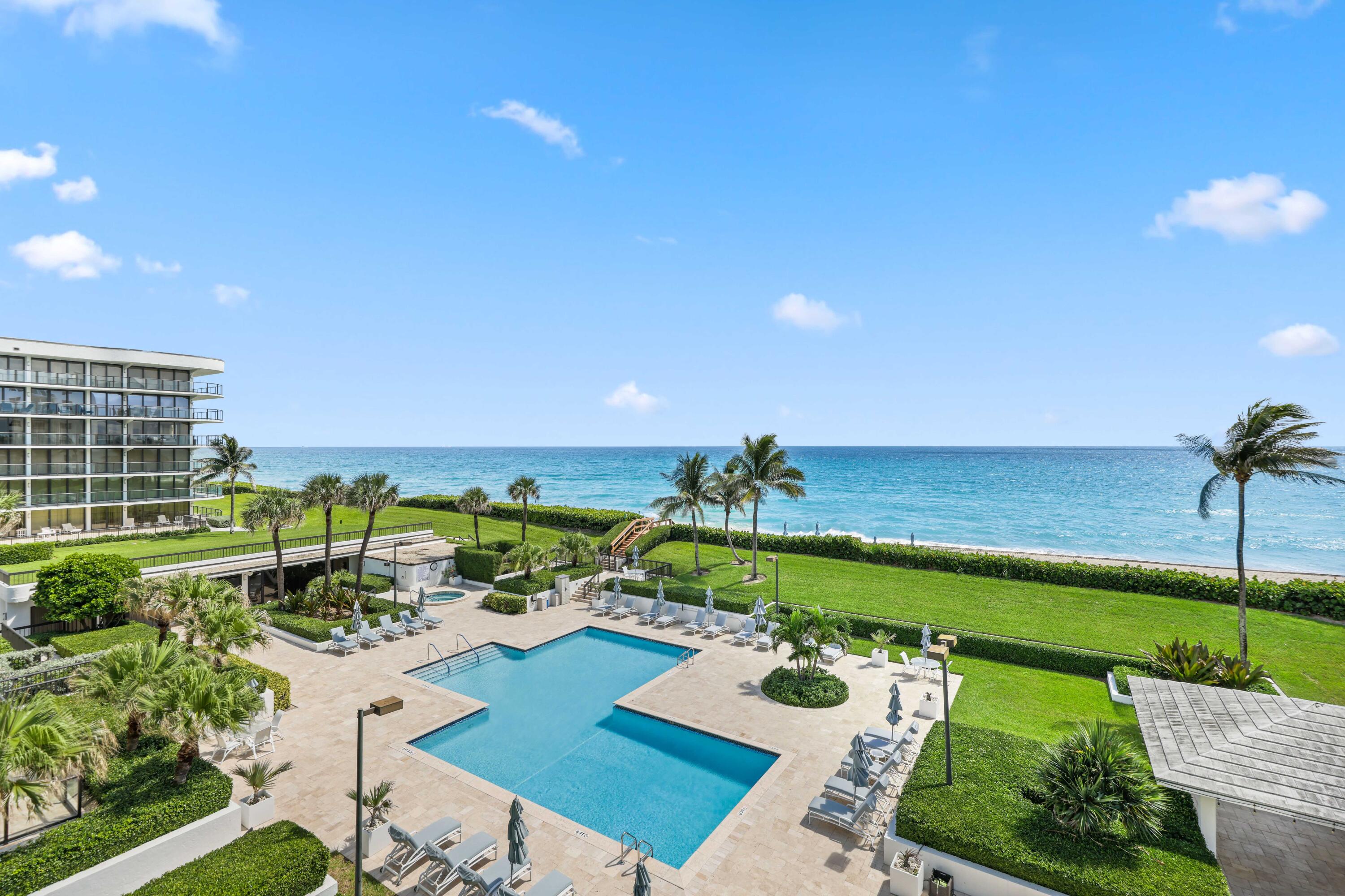 3440 South Ocean Boulevard, Unit 402S Palm Beach, FL 33480 - Photo 5 of 33 a view of a swimming pool and lounge chairs