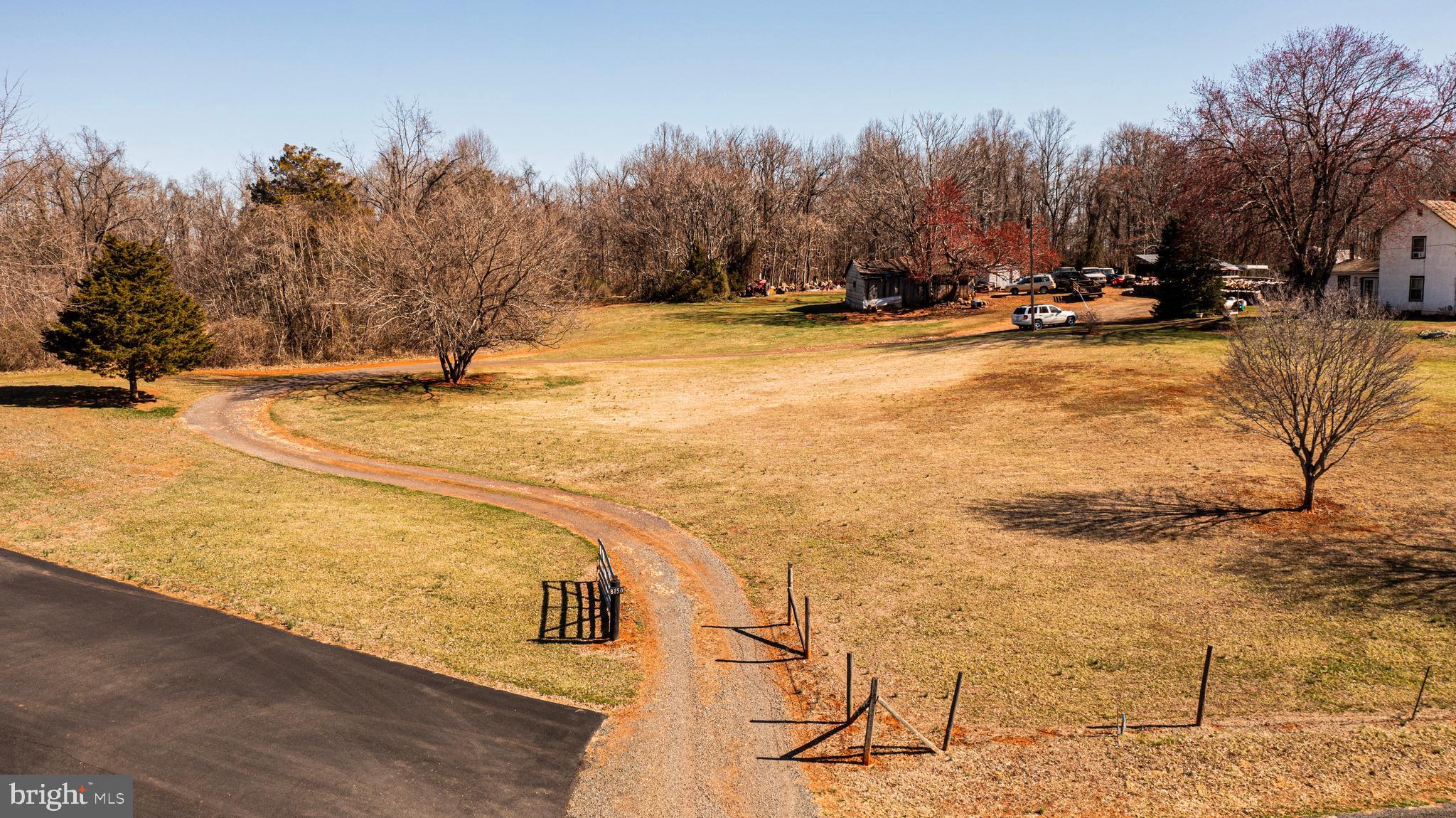 8158 Botha Road Warrenton, VA 20186 - Photo 3 of 30 a view of yard with swimming pool and trees