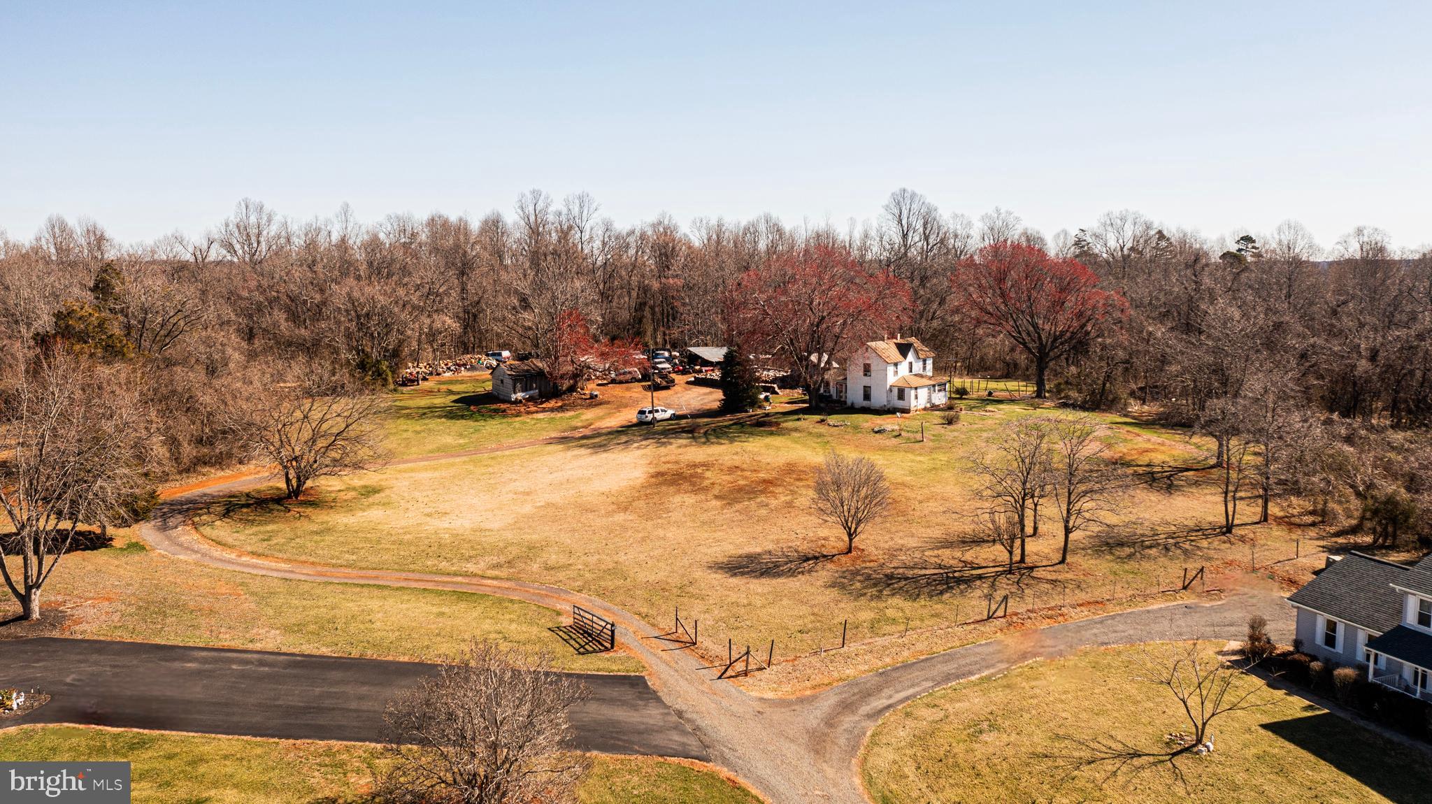 8158 Botha Road Warrenton, VA 20186 - Photo 8 of 30 a view of a yard with trees in the background