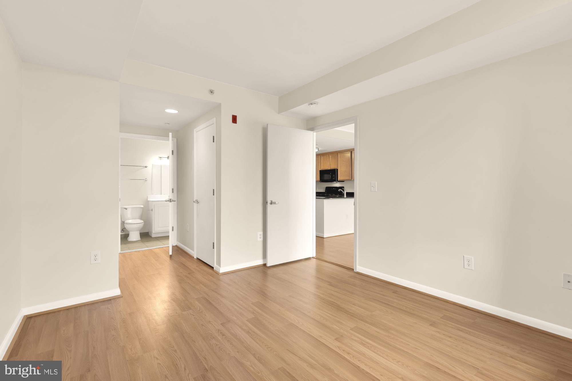 355 I Street Southwest, Unit 621 Washington, DC 20024 - Photo 30 of 34 a view of a big room with wooden floor and windows