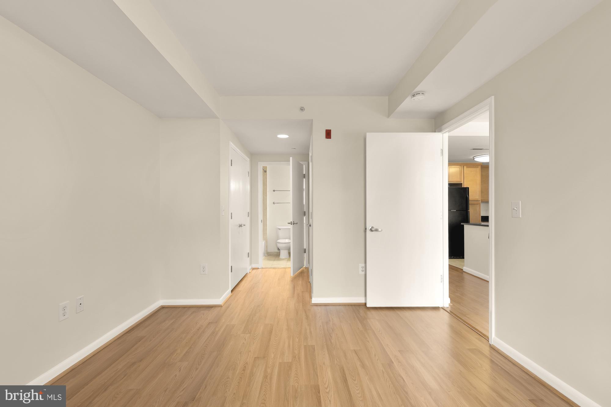 355 I Street Southwest, Unit 621 Washington, DC 20024 - Photo 31 of 34 a view of a big room with wooden floor and windows
