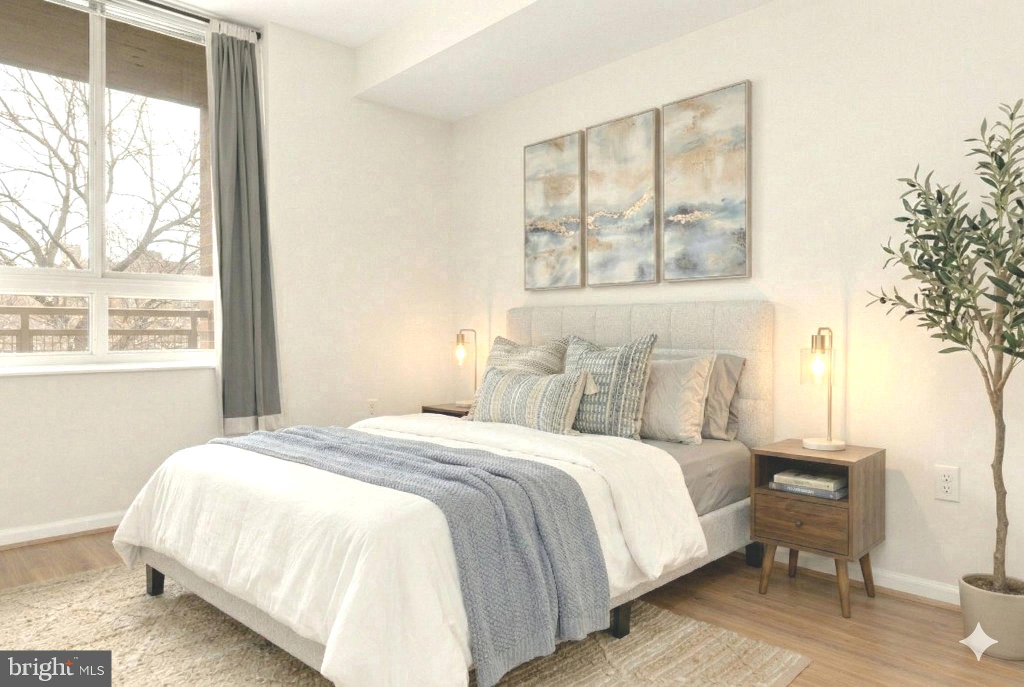 355 I Street Southwest, Unit 621 Washington, DC 20024 - Photo 5 of 34 a bedroom with a bed and a large window