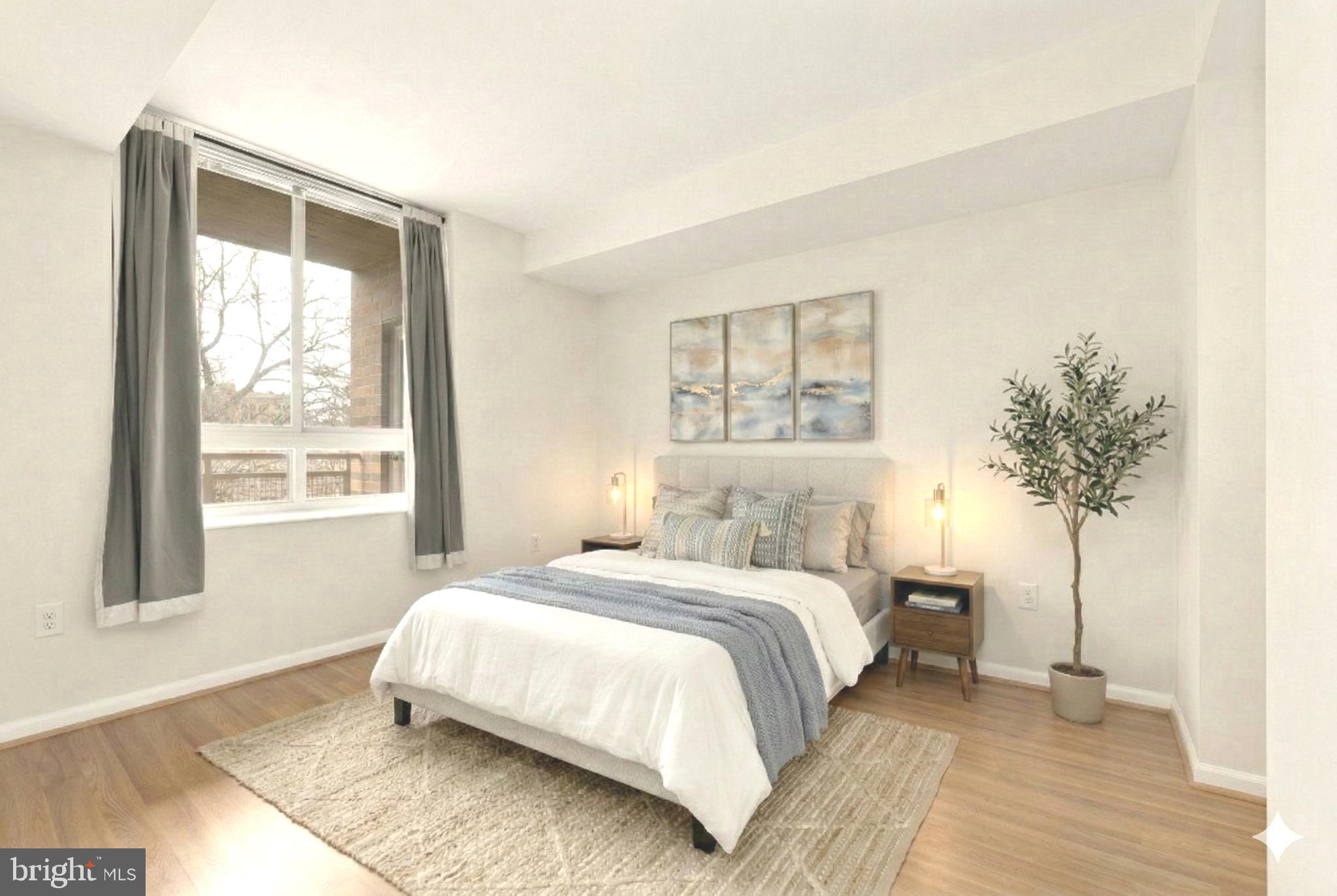 355 I Street Southwest, Unit 621 Washington, DC 20024 - Photo 6 of 34 a bedroom with a large bed and a potted plant