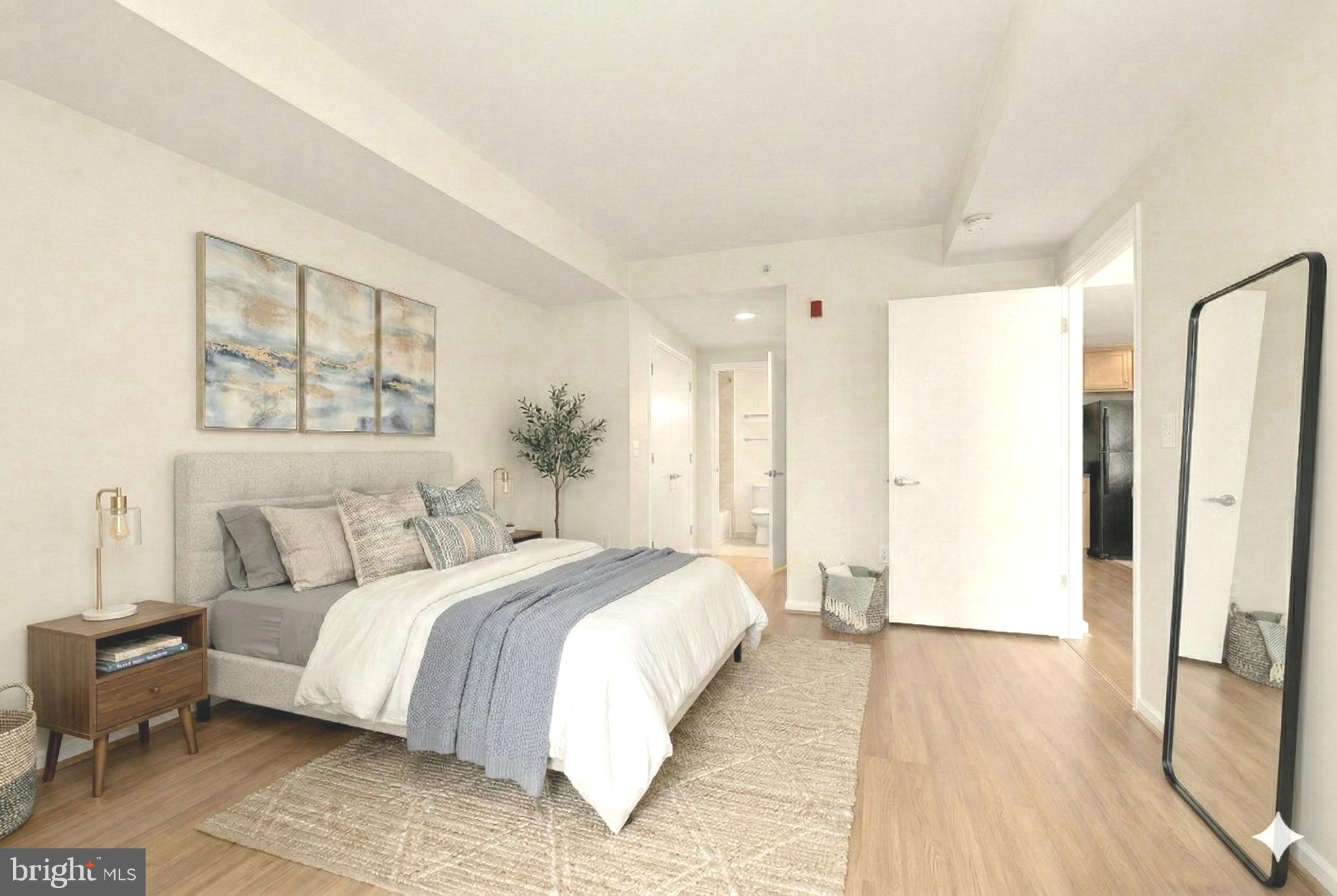 355 I Street Southwest, Unit 621 Washington, DC 20024 - Photo 7 of 34 a spacious bedroom with a large bed and a window