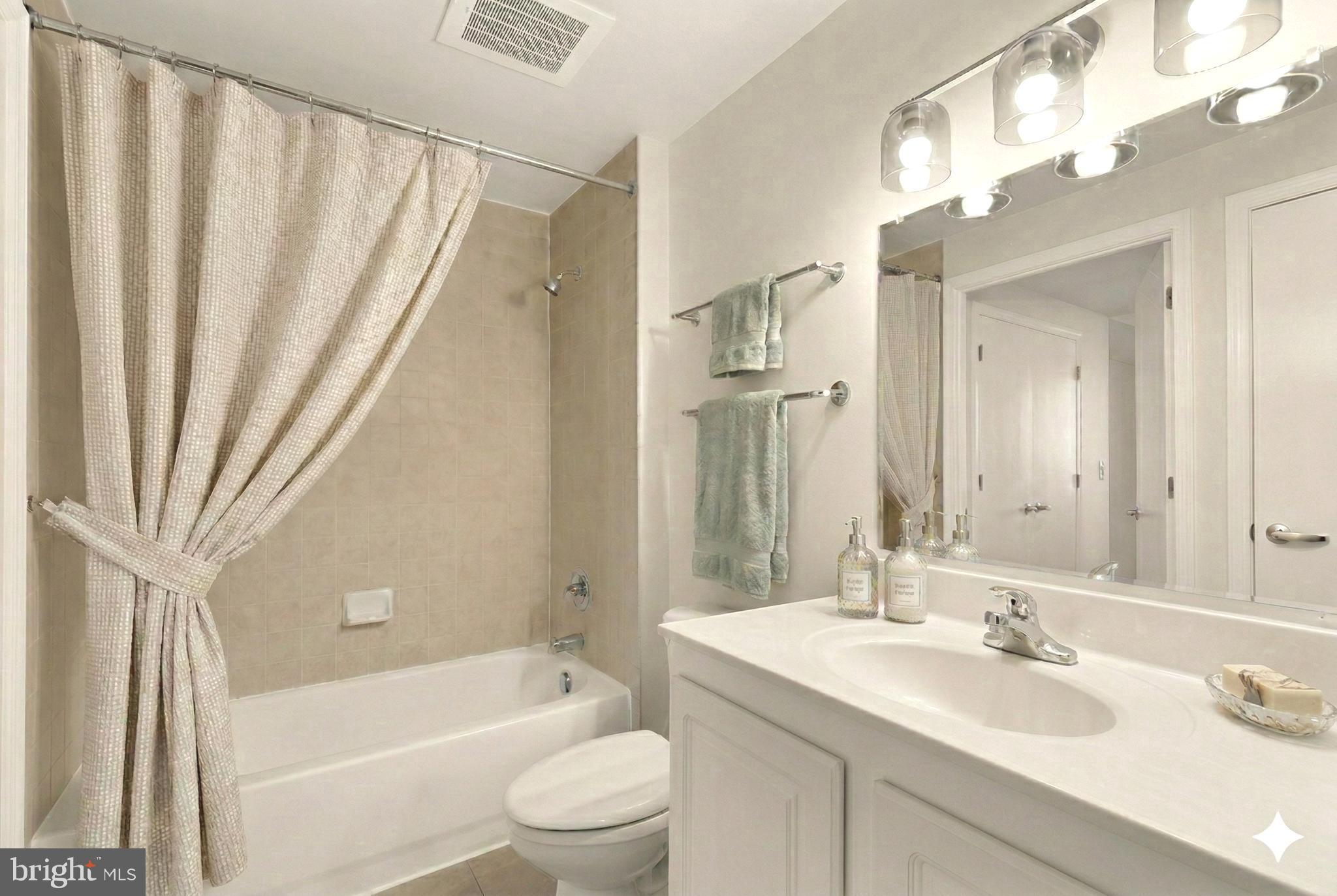 355 I Street Southwest, Unit 621 Washington, DC 20024 - Photo 8 of 34 a bathroom with a sink a toilet a tub and shower
