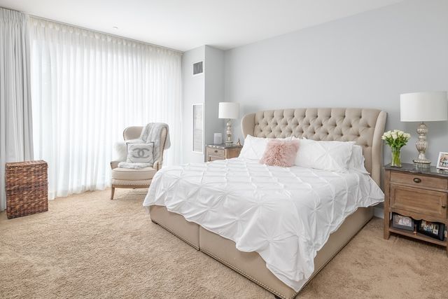 a bedroom with bed and a couch