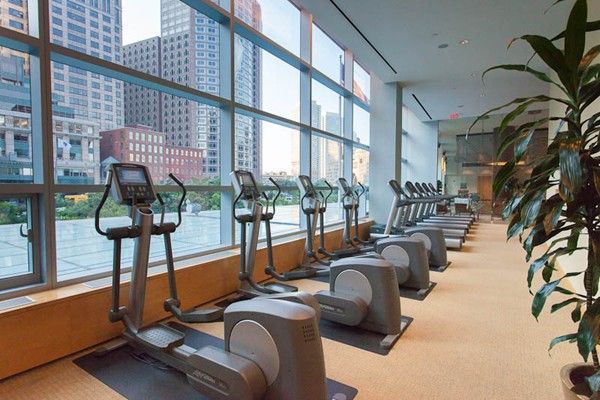 a view of a gym equipment and floor to ceiling window