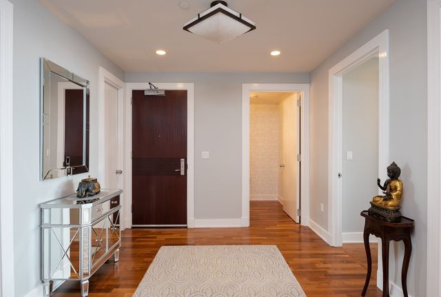 a view of a hallway with bathroom
