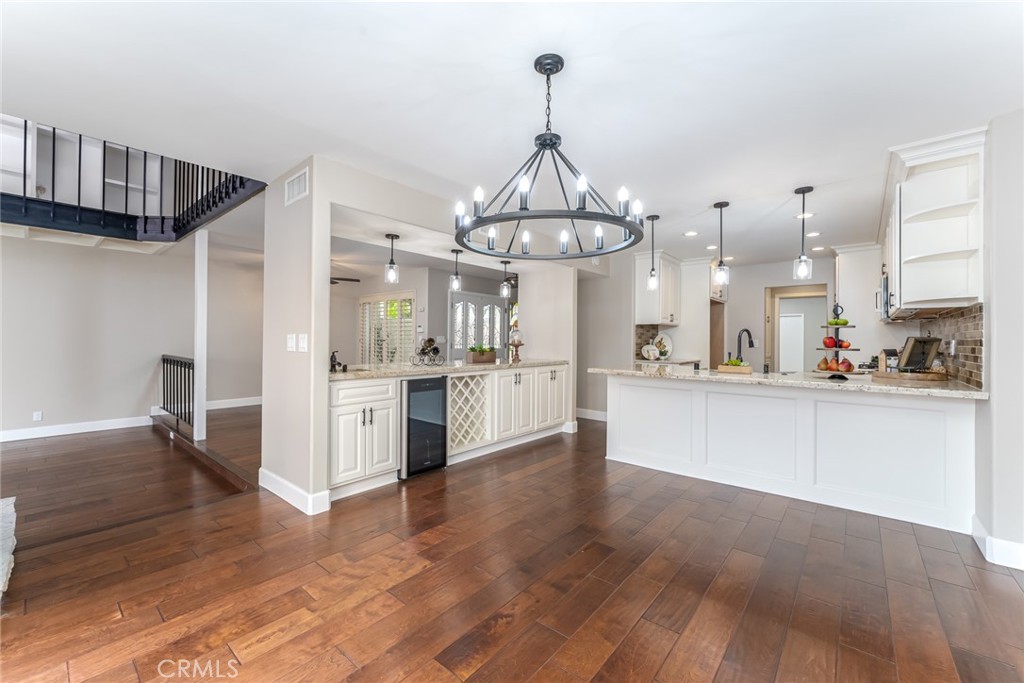 22058 Arrowhead Lane Lake Forest, CA 92630 - Photo 13 of 62 a view of a kitchen center island wooden floor and stainless steel appliances