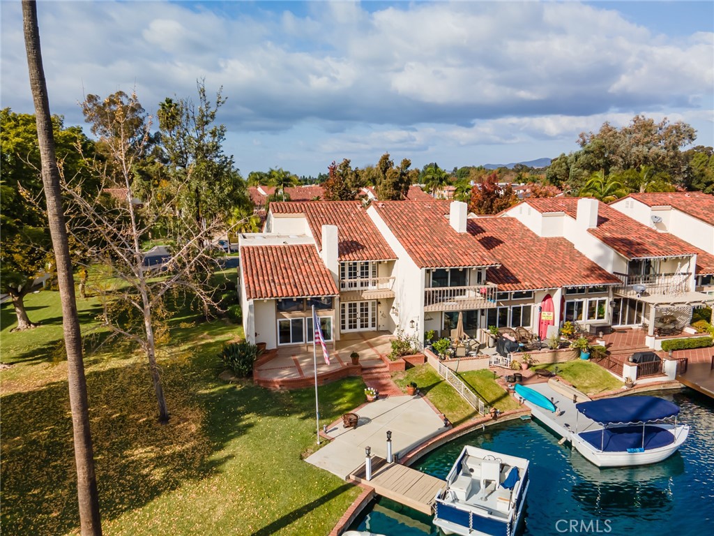 22058 Arrowhead Lane Lake Forest, CA 92630 - Photo 41 of 62 a front view of residential houses with yard and swimming pool