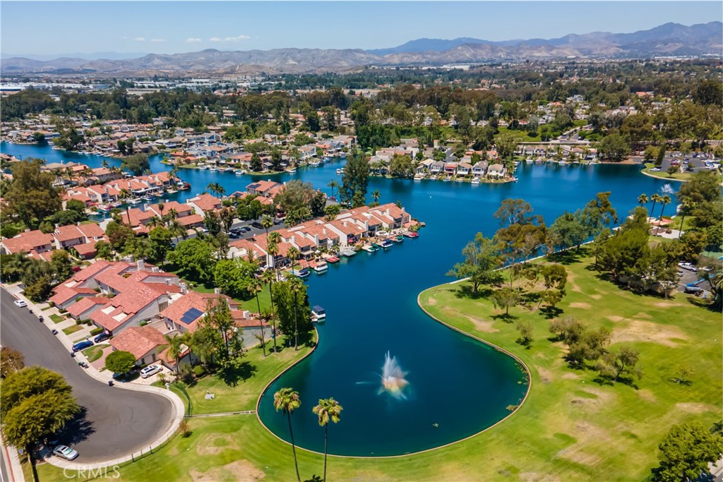 22058 Arrowhead Lane Lake Forest, CA 92630 - Photo 50 of 62 a view of a swimming pool with a table and chairs