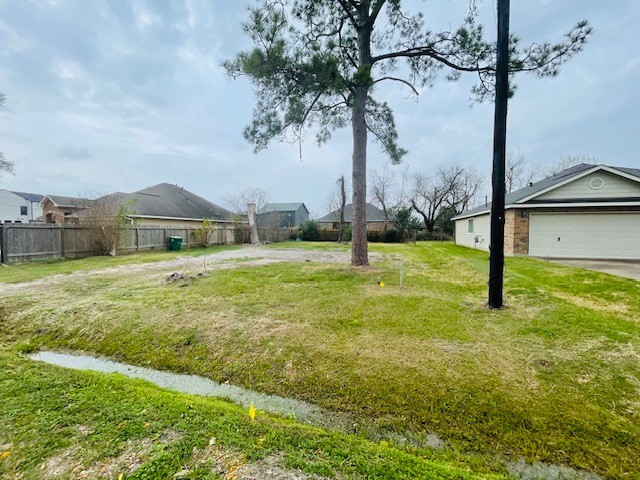 4817 Paula Street Houston, TX 77033 - Photo 3 of 7 a view of a garden with a tree