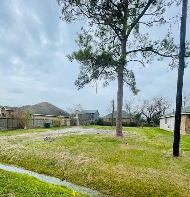 4817 Paula Street Houston, TX 77033 - Photo 5 of 7 a front view of a house with a yard