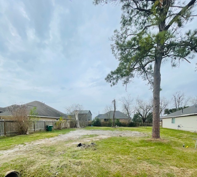 4817 Paula Street Houston, TX 77033 - Photo 7 of 7 a view of a large pool with a yard and large trees