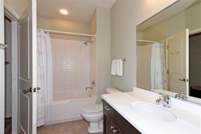 151 West Wing Street, Unit 610 Arlington Heights, IL 60005 - Photo 5 of 21 a bathroom with a sink toilet tub and shower
